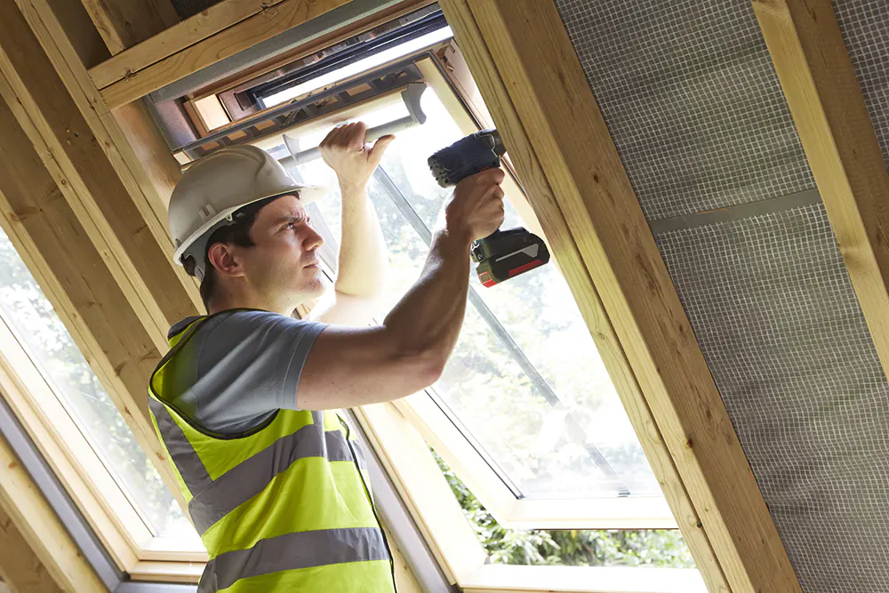 Window contractor working on a window