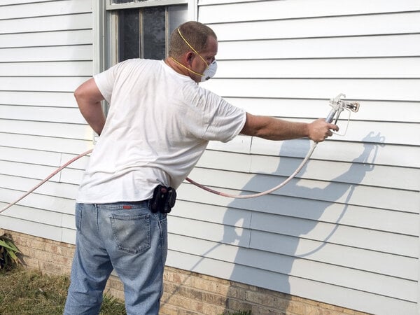 Can You Paint Vinyl Siding? 11 Repainting old vinyl siding with a paint sprayer
