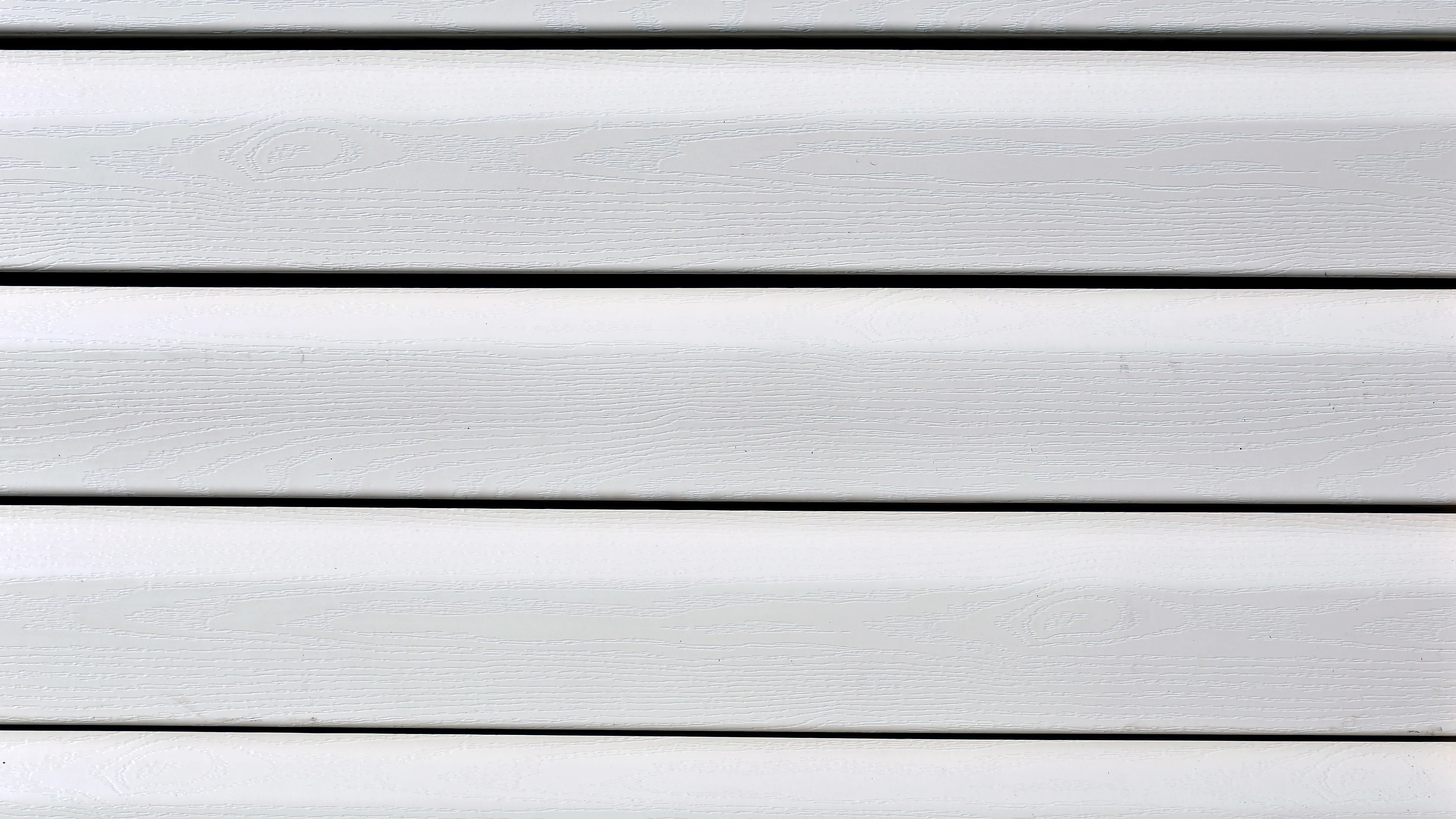 How Much Does It Cost To Replace Siding? The Cost Of 8 Popular Siding Styles 15 A close up of aluminum siding