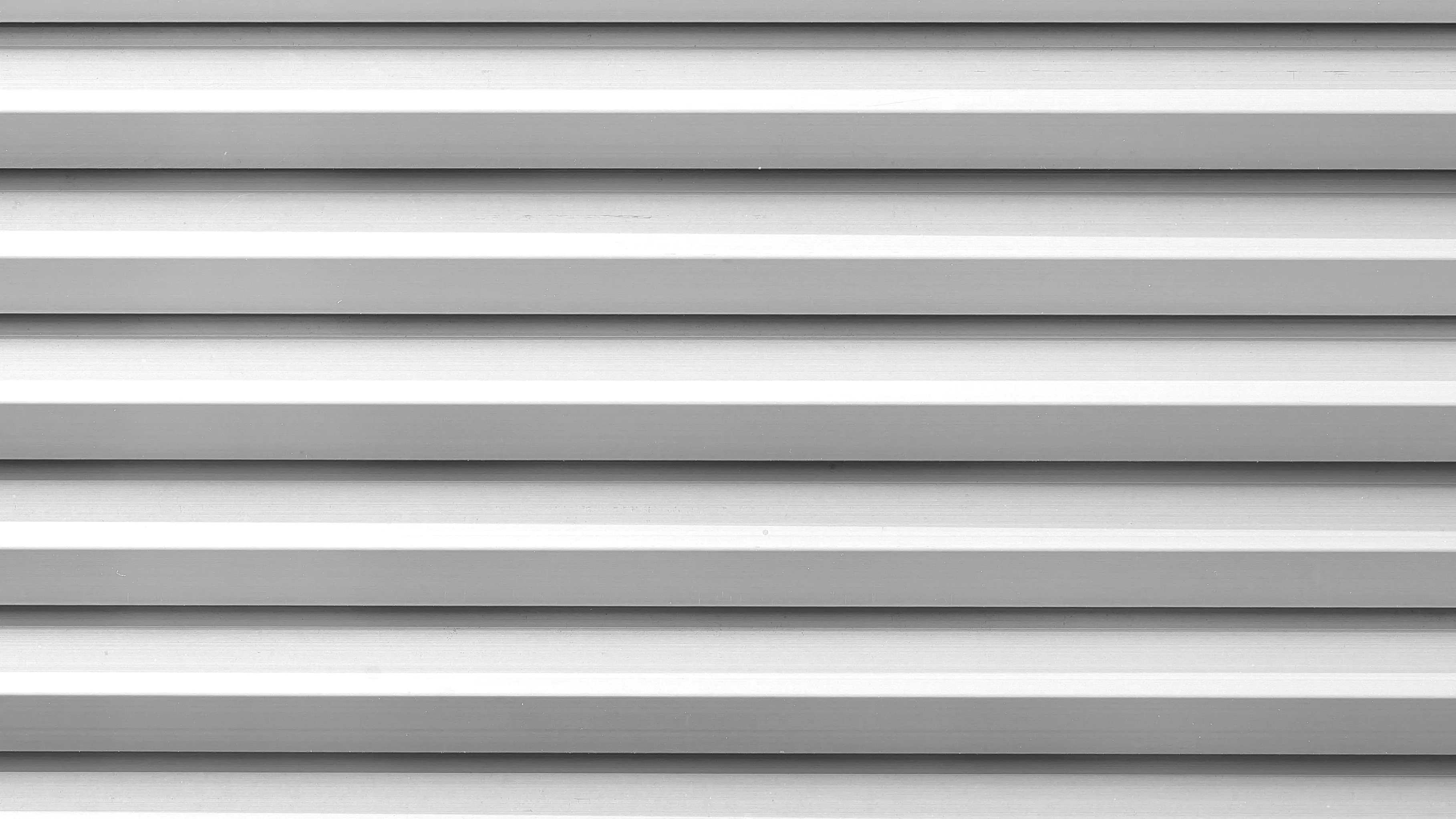 How Much Does It Cost To Replace Siding? The Cost Of 8 Popular Siding Styles 16 A close up of steel siding