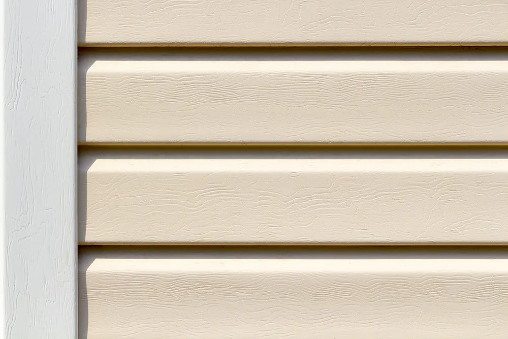 How Much Does It Cost To Replace Siding? The Cost Of 8 Popular Siding Styles 11 A close up of vinyl siding